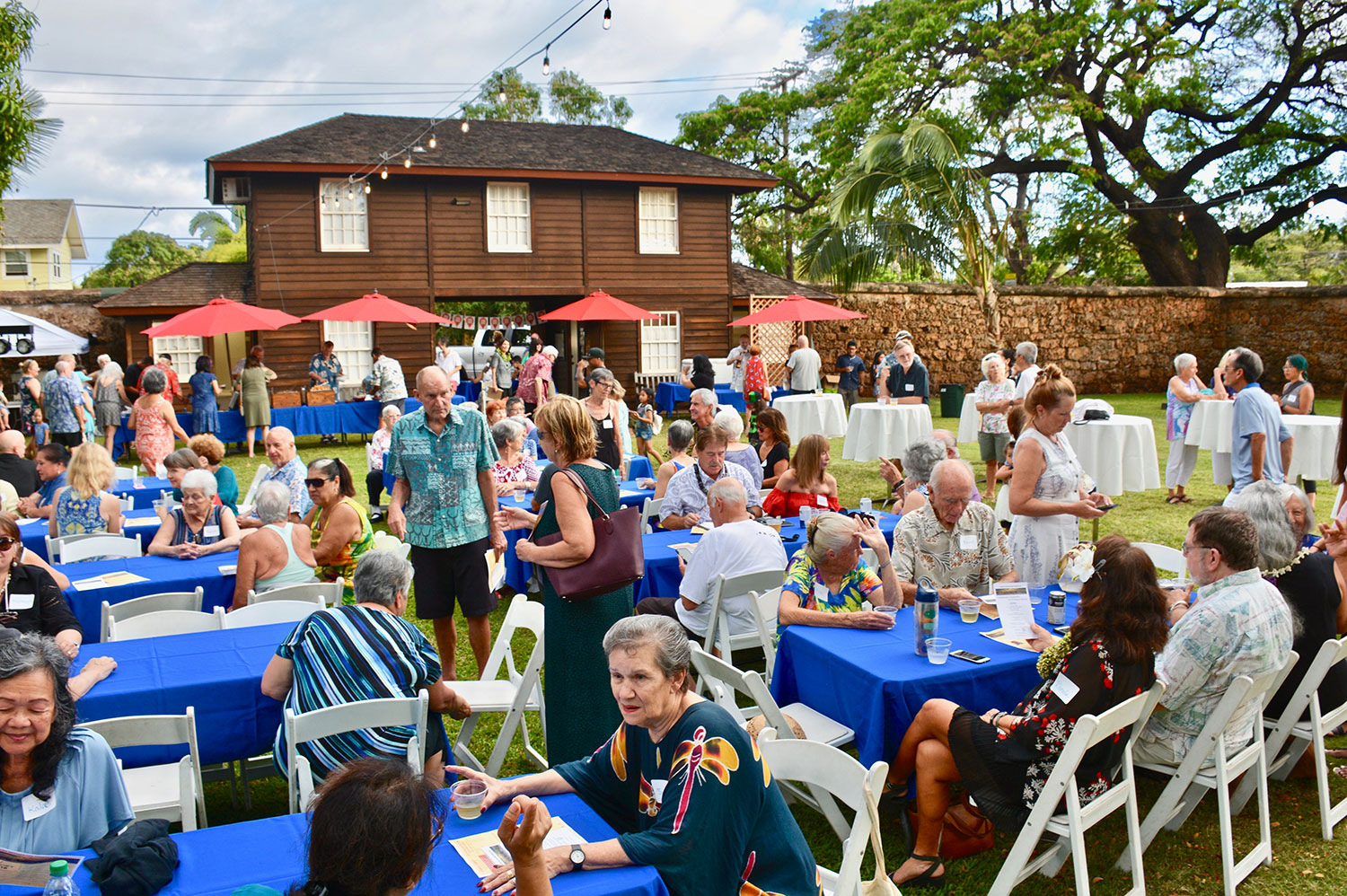 image of patrons gathered at Old Lahaina Prison in Lahaina for fundrasier