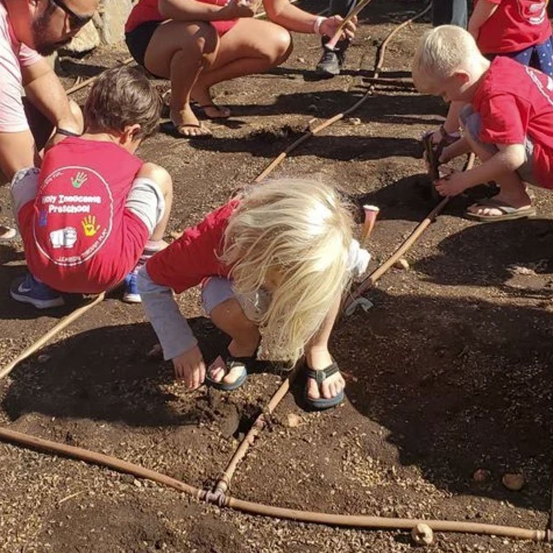 image of children in Lahaina planting trees